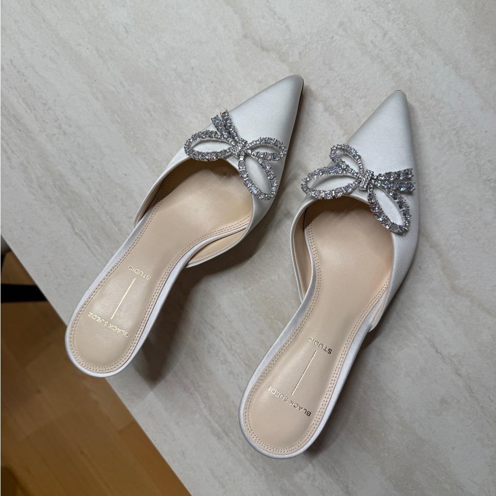 Chic White Mules with Rhinestone Bow by Black Suede Studio